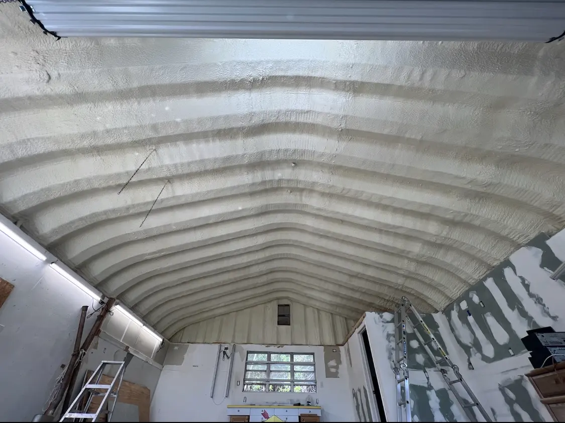 Spray polyurethane foam applied to the underside of a metal roof deck in Oak Grove